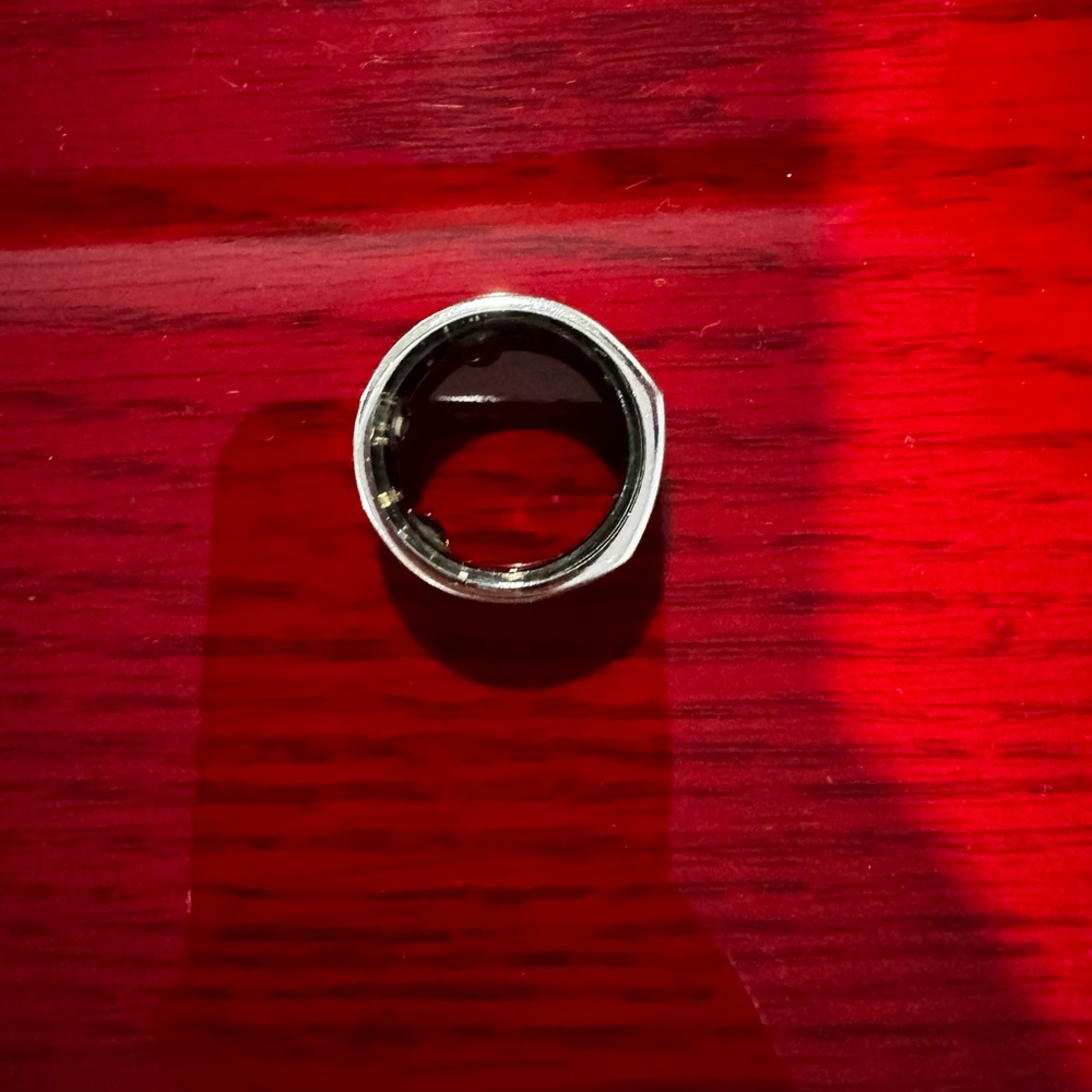 Oura generation 3 heritage ring. Charging base and charging cord included.
